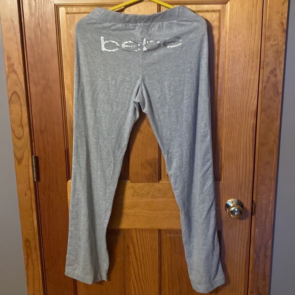 bebe sweatpants… Gray with velour stipe on side of legs / Velour tie at waist . - Picture 3 of 8